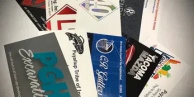 A fan of colourful business cards.