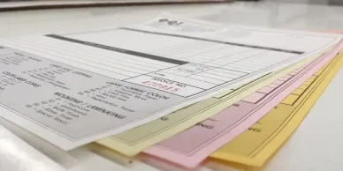 White, yellow and pink carbonless form sets.