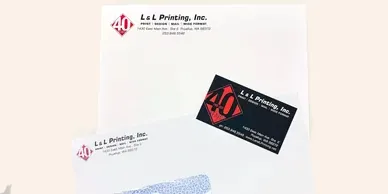 Letterhead, envelope and business card with the L&L Printing logo.